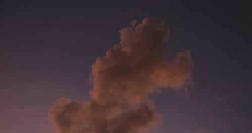 Peach cloud in twilight sky