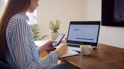 Young Businesswoman with Smartphone Working in Home Office Quarantine Concept