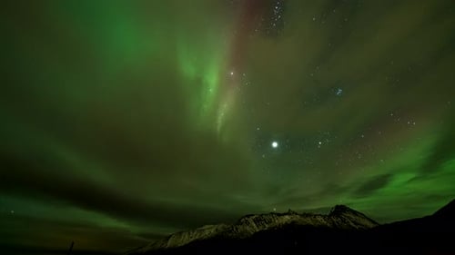 Cloudscape With Northern Lights At Starry Night Sky. Timelapse