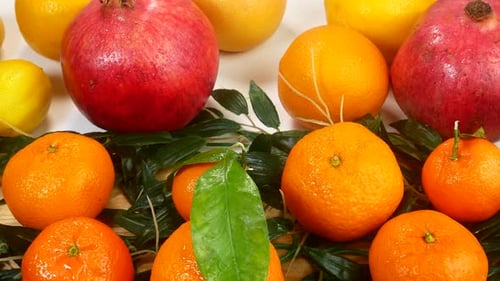 Vibrant Citrus and Pomegranate Fruit Still Life