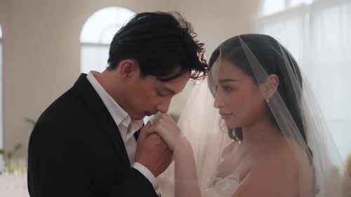 Romantic Wedding: Groom Kisses Bride's Hand Tenderly