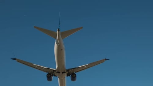 Plane Flying Over Head Landing at Airport at Day Time Slow Motion