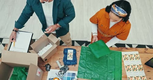 Teamwork, box and fashion designer people wrapping a product in office for courier shipping