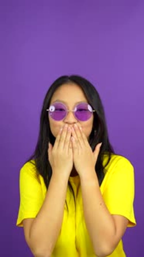 Woman Dancing with Glasses on Purple Background