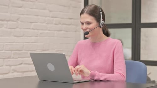 Call Center Woman with Headset Talking Online with Customer