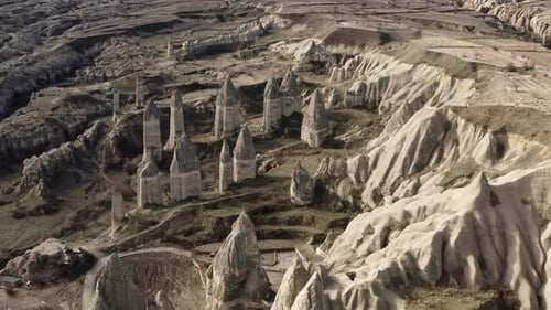 Aerial video of a panoramic view of natural rock formations in Cappadocia, Turkey