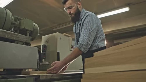 Carpenter Working with Industrial Tool in Wood Factory RAW Video Record