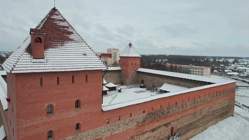 Aerial View of Ancient Fortress with Towers and Buildings in Courtyard in Residential Area of City