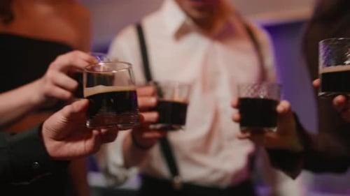 Young People Clinking Glasses on Party Close Up Hands of Young People Toasting and Drinking