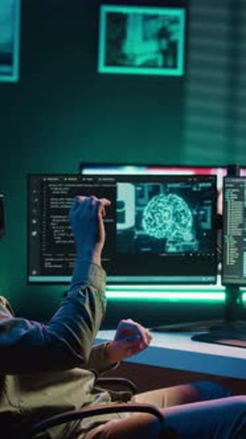 Young Adult Using VR Headset to Work With Code