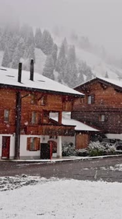 A Picturesque View of a Quaint Cozy Wooden Village Beautifully Drenched in Snow Creating a Serene