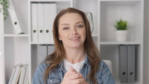 Woman Talking to Camera in Home Office Setting