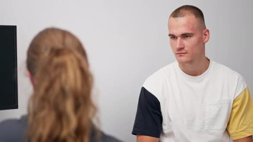 Close Up in a Modern Clinic in a Small Therapist s Office a Young Girl Doctor with a Stethoscope