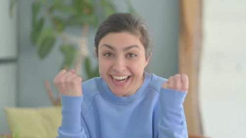 Excited Indian Woman Celebrating Success, Feeling Happy