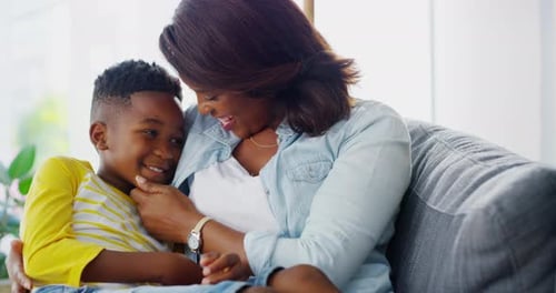Mother Embracing Smiling Child in a Home
