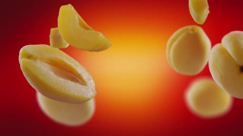 Flying Apricot and Apricots Slices in Red Background