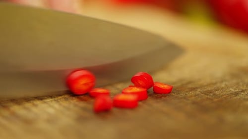 Vibrant Red Chili Pepper Sliced on Cutting Board