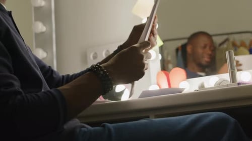 Actor Reviews Script in Dressing Room