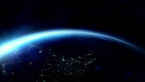 Planeta Terra girando mostrando a noite vista do espaço com luzes da cidade