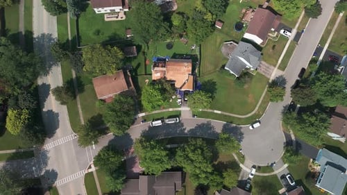 Roofers Installing a New Roof on an Residential Building Wide Aerial Top Down Footage