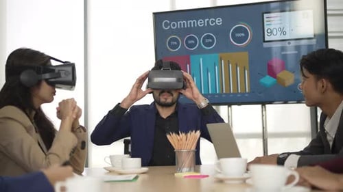 White collar worker are using VR simulator while meeting at office.