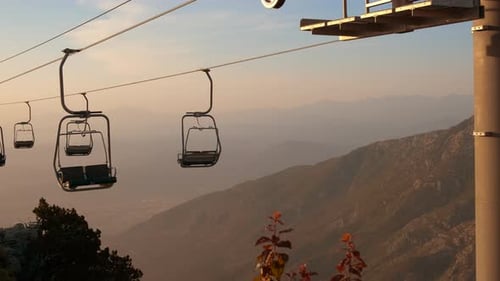 Ski Lift Ascending Mountain During Sunset