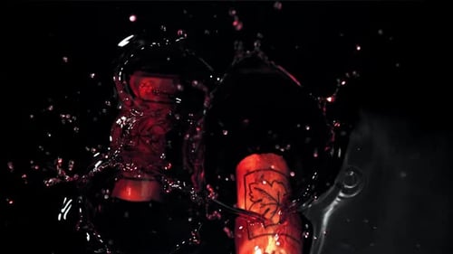 The Corks Fall Into the Red Wine Filmed on a Highspeed Camera at 1000 Fps