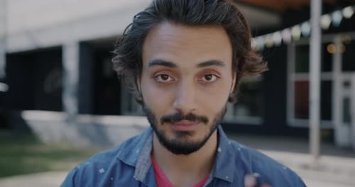 Young Adult Puts on a Protective Face Mask