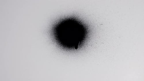 Abstract Black Paint Spreading on White Background