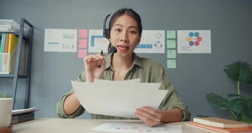 Young Woman Presenting Business Data on Video Call