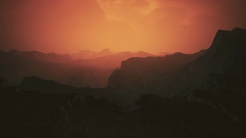 Dramatic Sky Over Rocky Mountains at Sunset