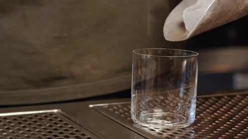 Bartender Dadding Ice in Glass Closeup Barman is Going to Make Soma Drinks for Guest in the Bar