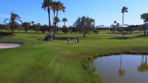 Aerial View of a Golf Course with People on It
