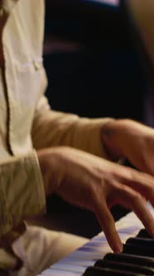 Vertical Video Singer Performer Creating a Song on Piano Midi Controller in Studio