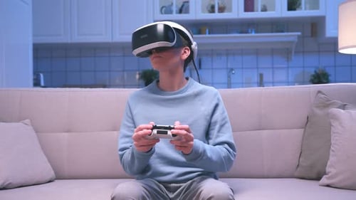 Teen Playing VR Video Game at Home