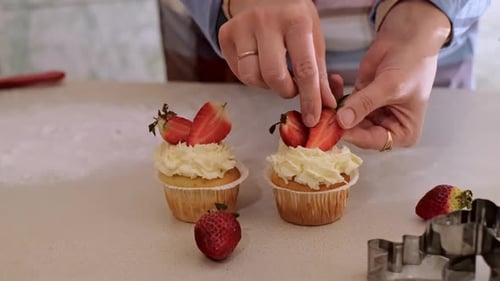 Decorating Two Cupcakes with Strawberry Slices