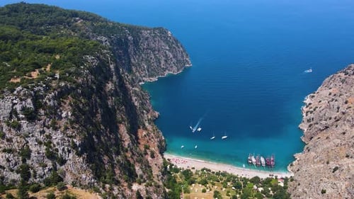 Beautiful view of the beach with boats, pure nature, sea and ships. Shot from a drone.