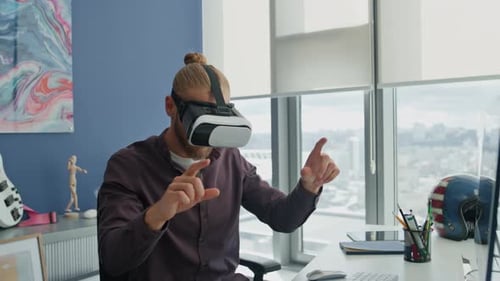 Involved Startuper Swiping Metaverse in Home Office. VR Glasses Freelancer Enjoying Futuristic
