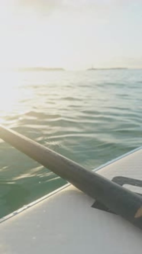 Stand Up Paddle in the Sea at Dawn in Vertical