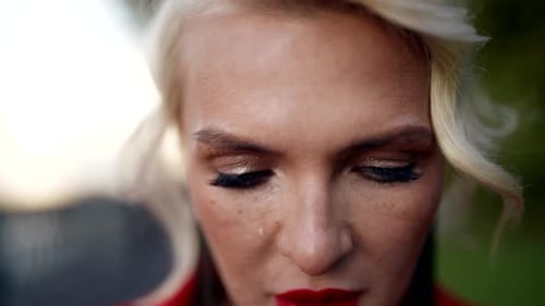 Portrait of Emotional Crying Woman Looking at Camera Closeup View of Face Lady on City Street