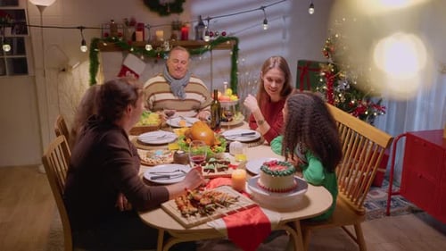 Family Cheers Together at Festive Christmas Dinner