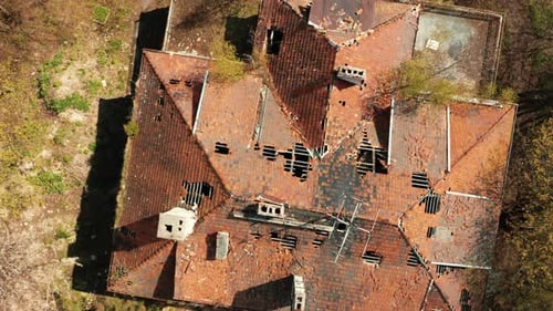 Aerial View of an Abandoned Old Country House Standing in the Forest
