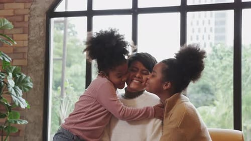 Heartwarming Scene: Mother and Daughters Embrace Lovingly