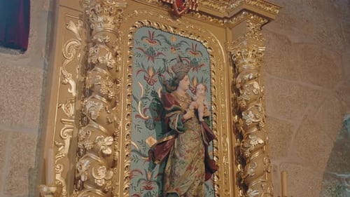 Golden church altar with religious statue and ornate detailing