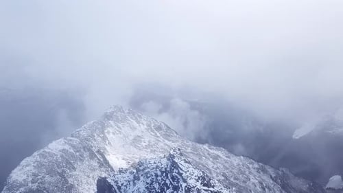 Hikers standing on top of a peak in the coast mountains of Canada