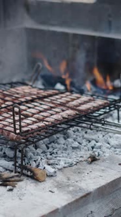Unrecognizable Man Turns the Grill Upside Down
