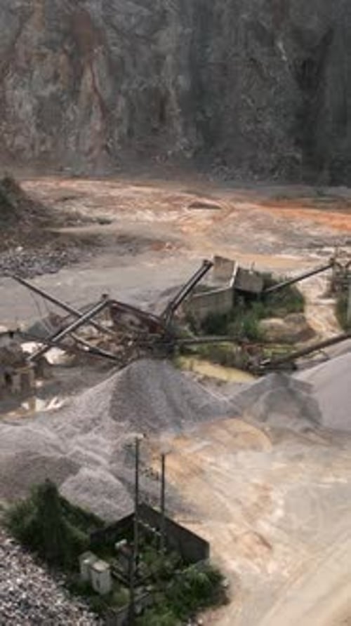 Cement Factory at the Foot of the Great Mountains Where Minerals are Extracted for Subsequent