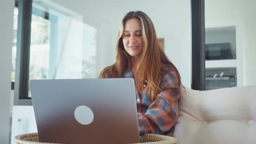 Home Office Woman Using Laptop at Home Working Online and Smiling with Satisfaction Home Office