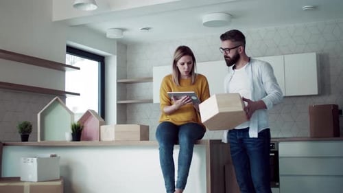 Couple moving in, planning on tablet device