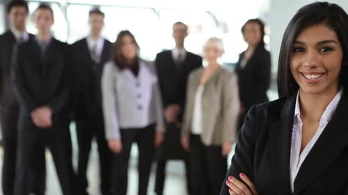 Confident Woman with Business Team Standing